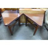 A pair of teak triangular side tables