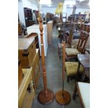 A teak standard lamp and one other