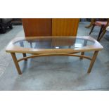 A Nathan teak and glass topped coffee table