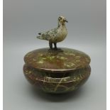 A serpentine lidded pot with cold painted model of a pigeon and two other cold painted animals; bird