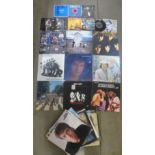 A collection of LP records and 7" singles including The Who, The Beatles, Elton John, Status Quo,