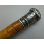 A bamboo walking cane with niello silver top