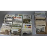 Postcards; a tray of postcards, vintage to modern