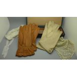 A glove box, two pairs of kid leather gloves and two Victorian baby bonnets