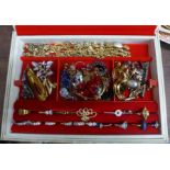 A collection of costume jewellery including rings, brooches, necklaces, etc., in a jewellery box