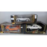 Two Maisto and one Burago 1:18th scale die-cast model vehicles, Dodge, Rolls-Royce and Porsche,