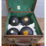 Four Jaques & Son bowling woods in a leather case marked with initials T.J.L. **PLEASE NOTE THIS LOT