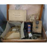 A suitcase containing a WWII transmitter, earphones, two valves, small canvas kit bag with leads,