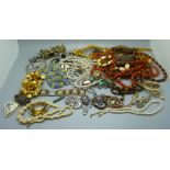 A collection of vintage jewellery, two silver bangles, one a/f, two silver brooches, a scarf clip,