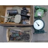 A box with two vintage telephones, Salter Family scales, vintage toys and wooden pipes