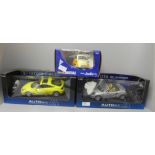 Three die-cast model vehicles, Autoart x2 and a Revell BMW Isetta, boxed