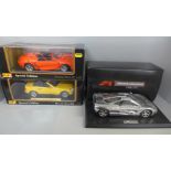 Three 1:18th scale die-cast model vehicles, 2x Maisto and a McLaren 1993, all boxed