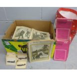 A box containing a large quantity of OS maps and aircraft postcards and The War Illustrated