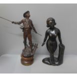 A bronze effect figure and a carved figure of a lady