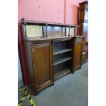 A Victorian Aesthetic Movement walnut breakfront bookcase