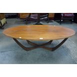 A teak oval coffee table