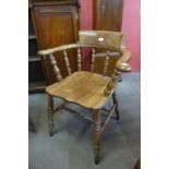 A Victorian beech and elm smokers bow chair