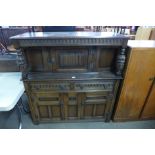 A carved oak court cupboard