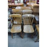 A set of four Victorian elm and beech farmhouse kitchen chairs