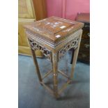 A Chinese hardwood and mother of pearl inlaid jardiniere stand