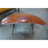 A teak and black metal boomerang shaped occasional table