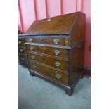 A George I style burr walnut bureau