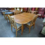 A Danish teak extending dining table and four chairs