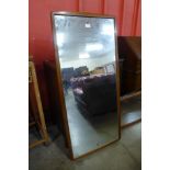 A teak framed mirror