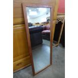 A teak framed mirror