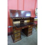 A Victorian mahogany secretaire kneehole desk