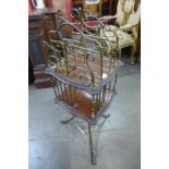 A Victorian mahogany and brass revolving newspaper stand