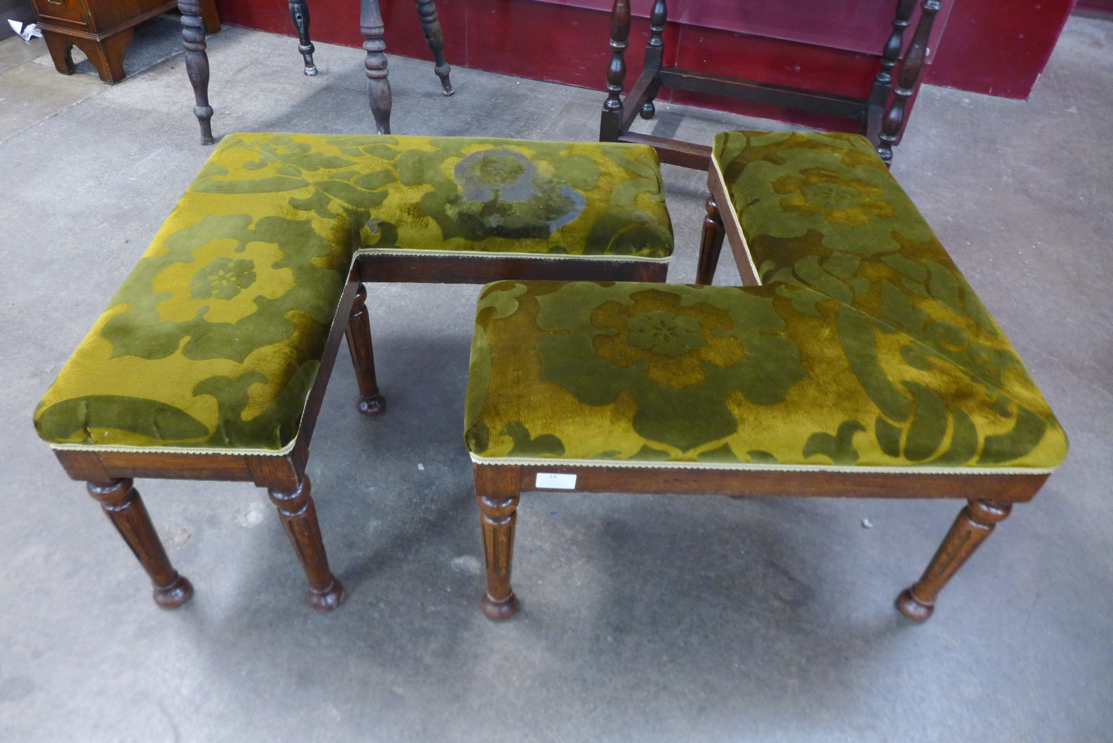 A pair of Victorian oak and upholstered asymmetric stools