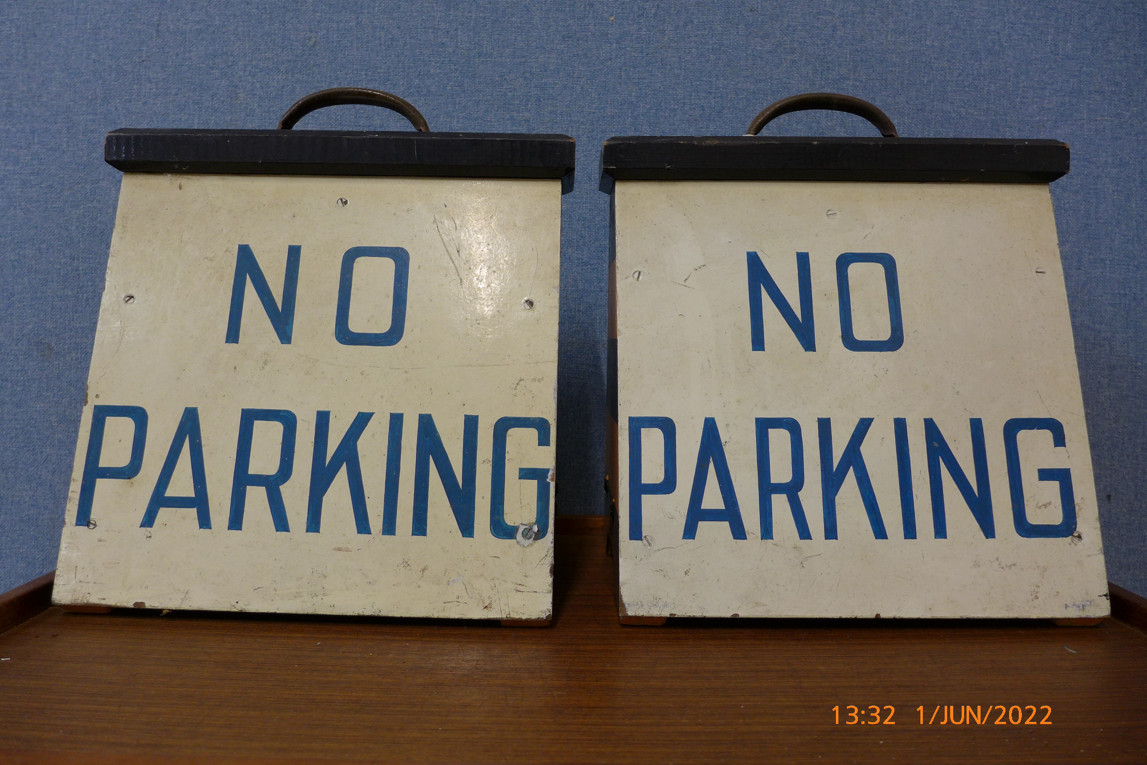 A pair of vintage painted wooden No Parking signs