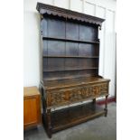 A carved oak geometric dresser