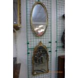 A gilt metal framed mirror and one other