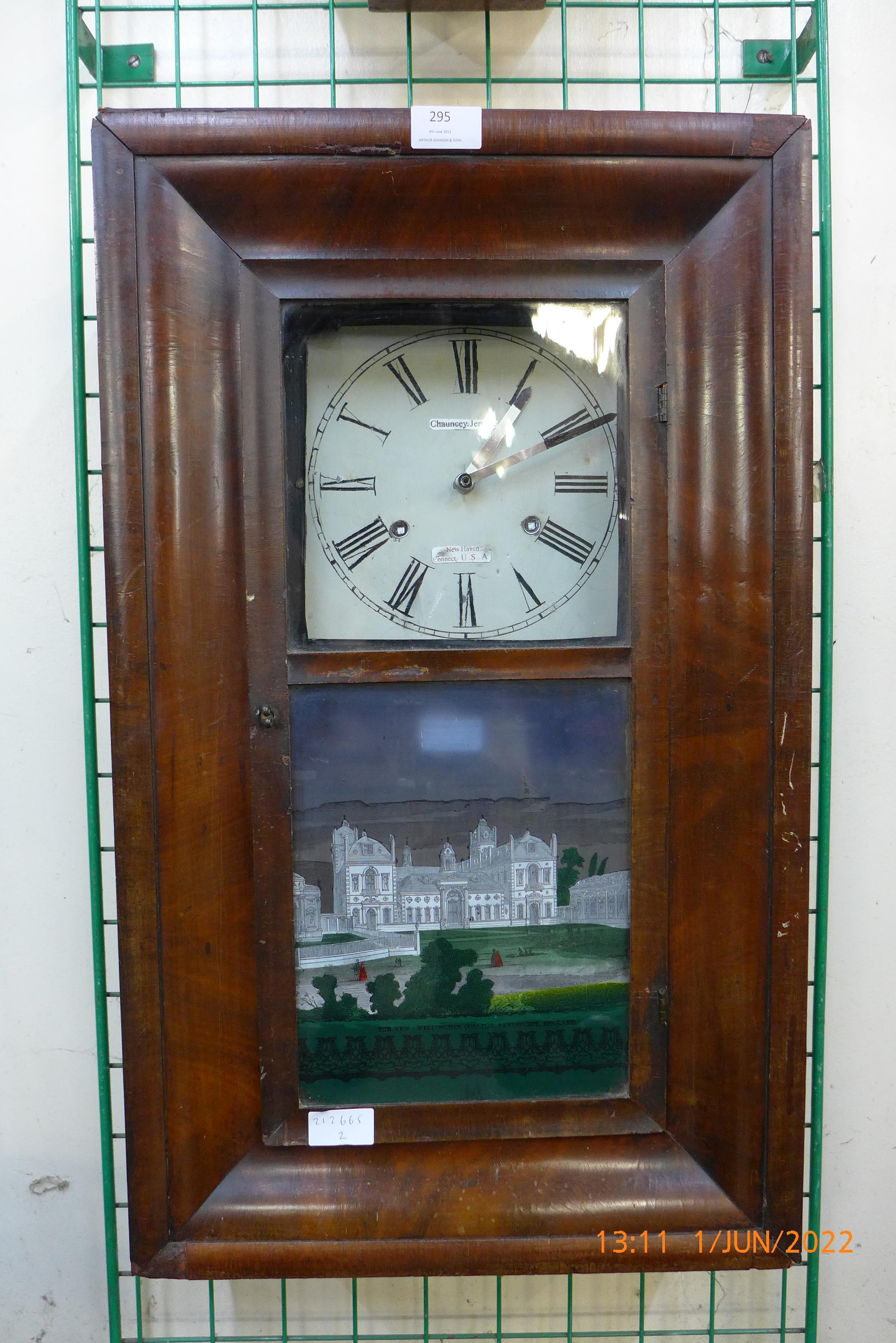 An American wall clock with transfer printed glass front, The New Wellington College, Sandhurst,
