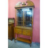 An Edward VII marquetry inlaid satinwood side cabinet