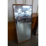 A teak framed mirror