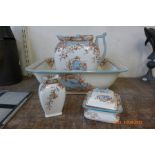 A Doulton's Burslem Staffordshire wash set; jug, bowl, soap dish and brush holder