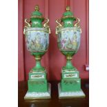 A pair of Italian Neo Classical style green porcelain lidded vase's, decorated with romantic scenes