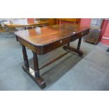 An early Victorian rosewood two drawer stretcher table