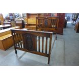 An Edward VII carved oak double bed