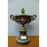 A continental metal two handled urn and cover