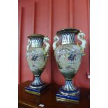 A pair of large Italian blue and gilt porcelain vases, decorated with Venetian scenes