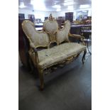 A French Louis XV style giltwood canape settee