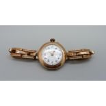 A 9ct gold wristwatch and expanding bracelet strap, 27mm case