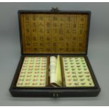 A complete Mah Jong set in lacquered box