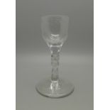 A Georgian wine glass with ovoid bowl, hexagonal facted stem, conical foot with snapped pontil,