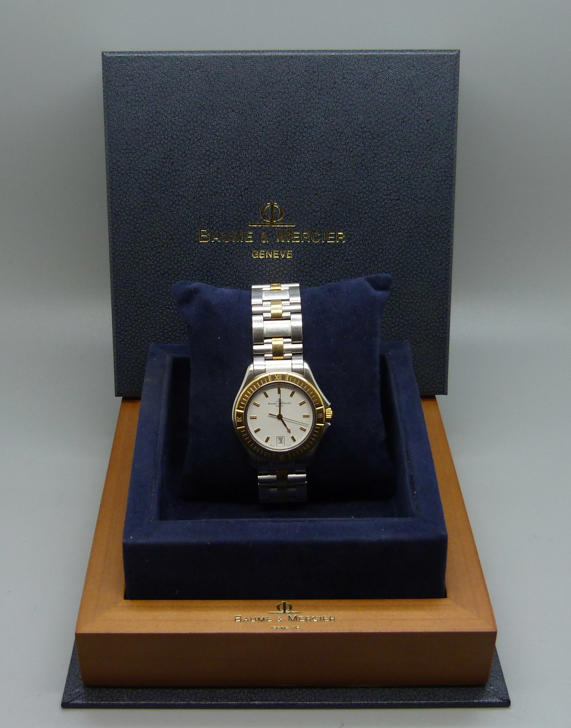 A Baume & Mercier Geneve Malibu wristwatch, with original receipt, paperwork, box and extra links,