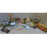 A collection of tin-plate toys; Transport bus, two model rail crossings, Minic Toys Briotish